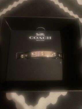 COACH Silver Tone Crystal Accent Bangle Bracelet